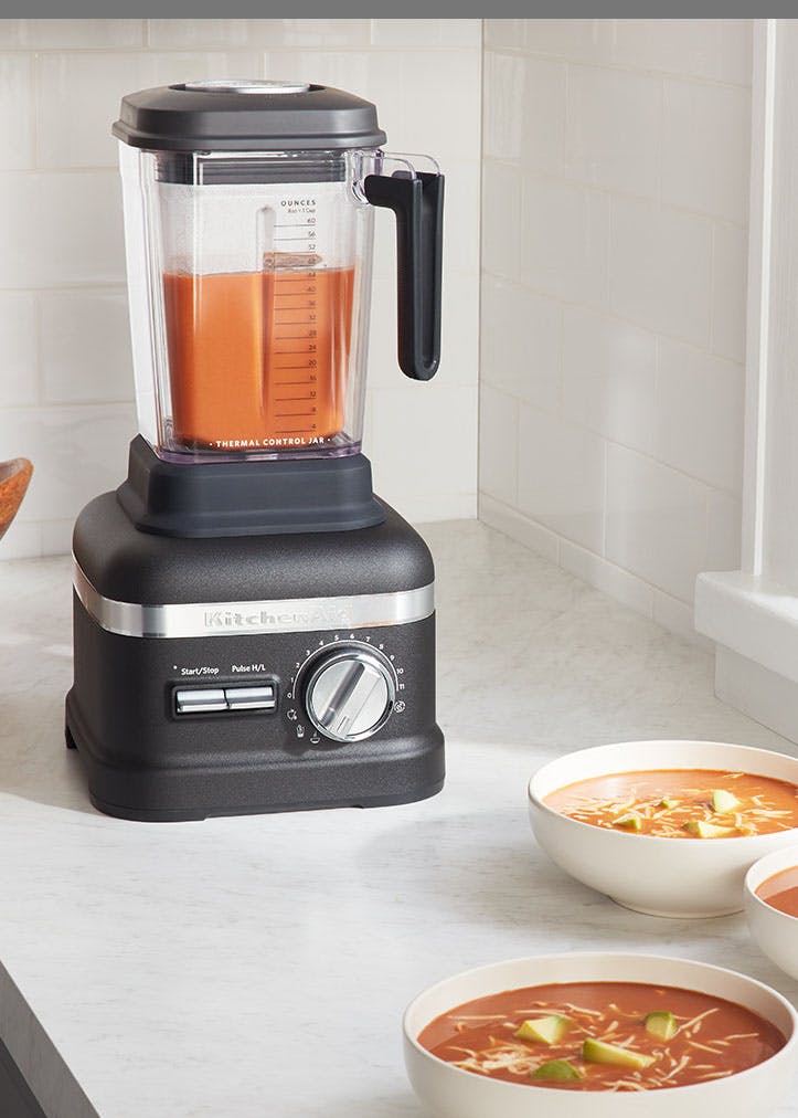 Pro Line Blender sitting on counter with bowls of soup